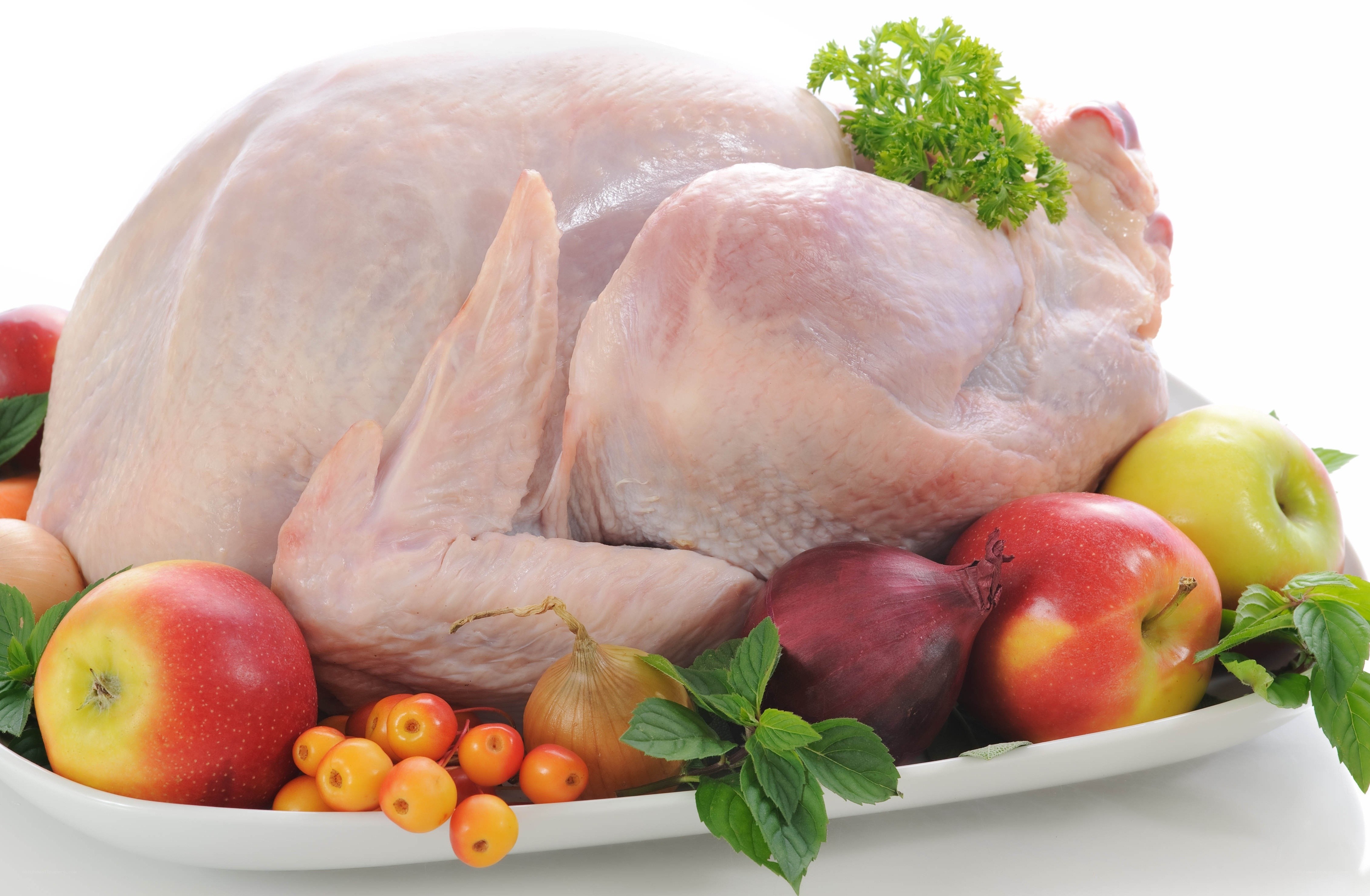 raw turkey with fruits and vegetables