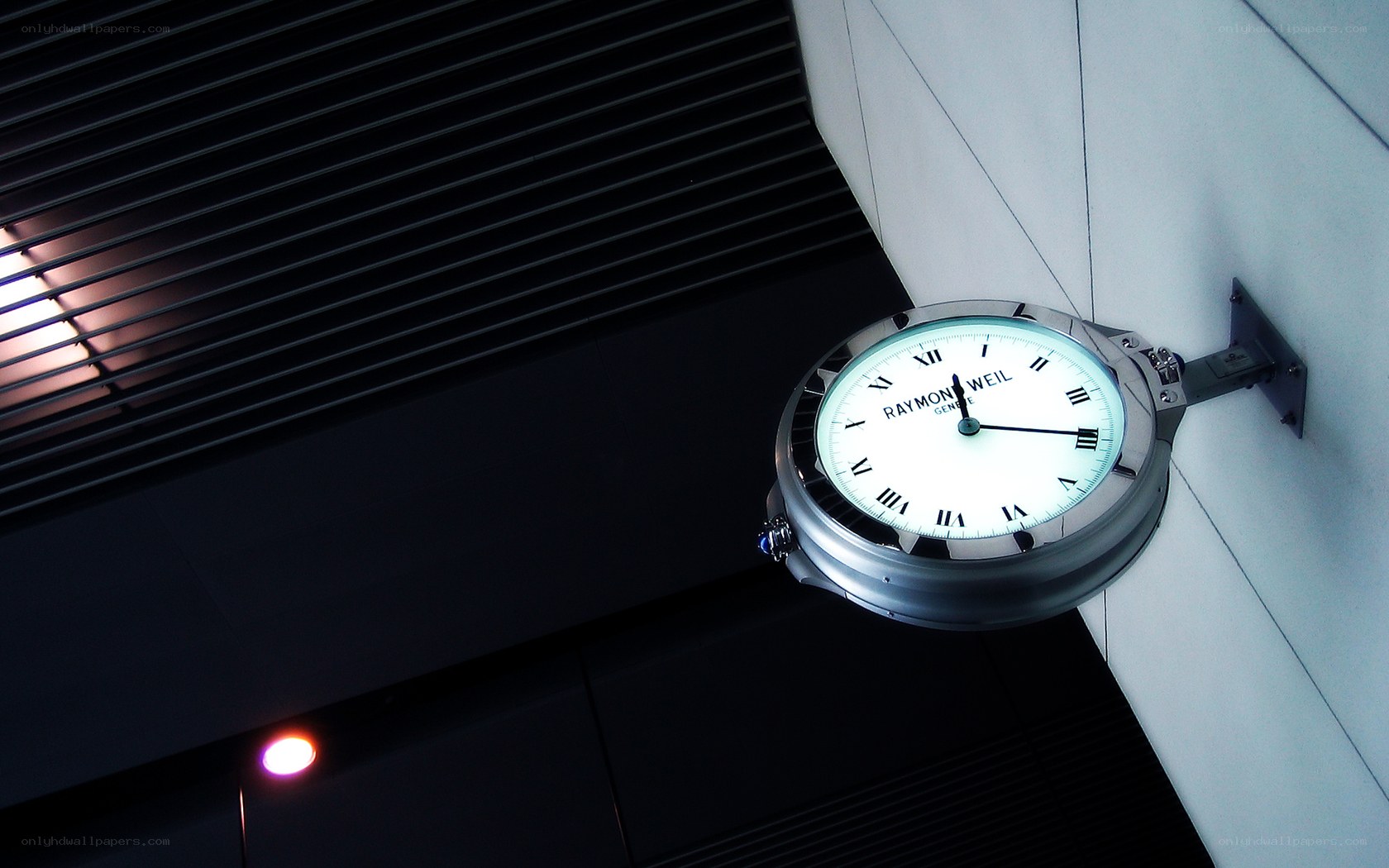 Raymond Weil clock on wall