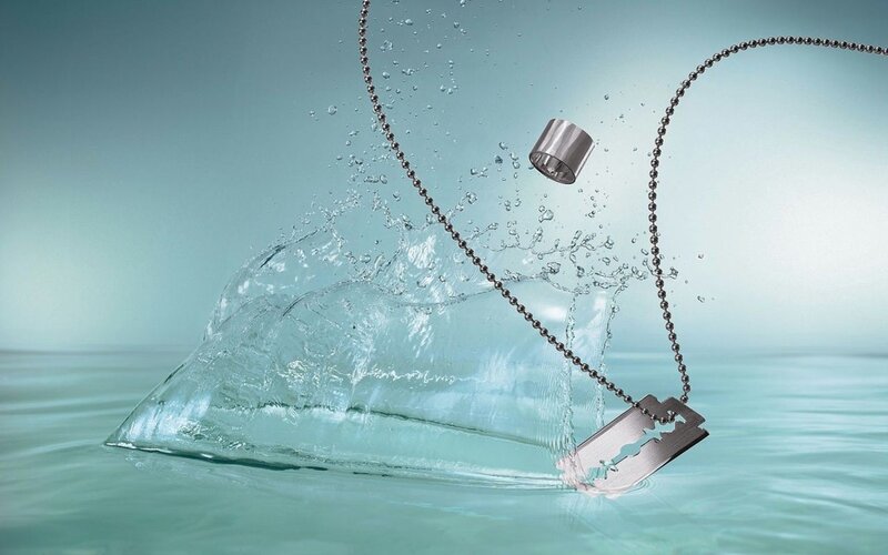 razor blade necklace splashing in water