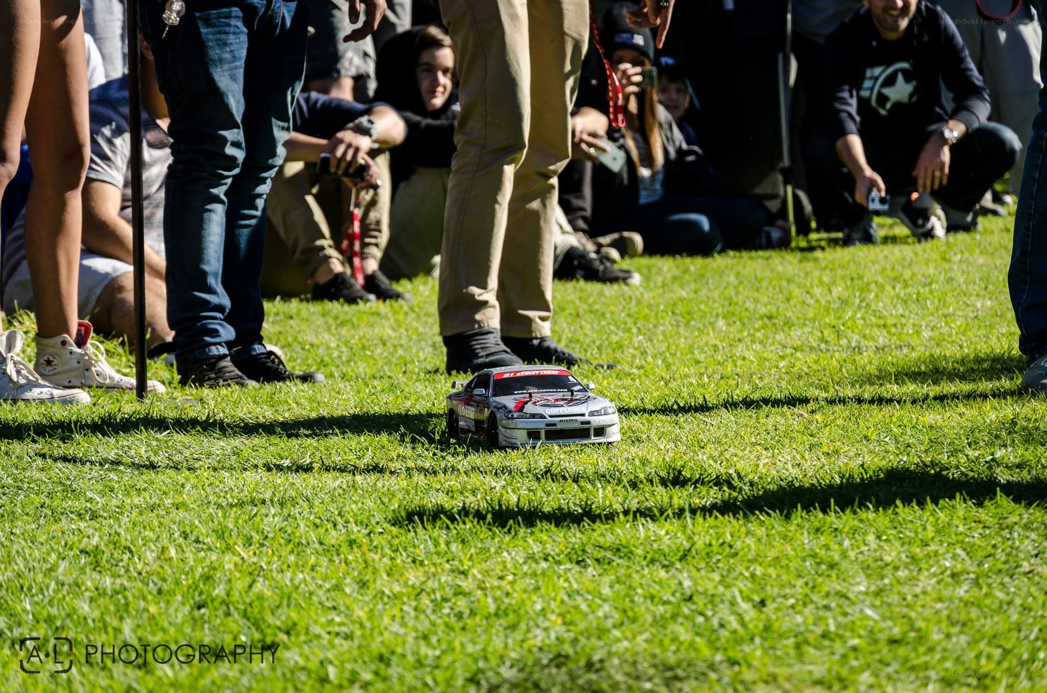 RC car on grass with crowd