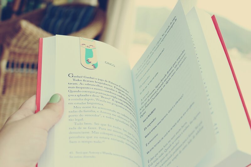 reading a book with a cat bookmark