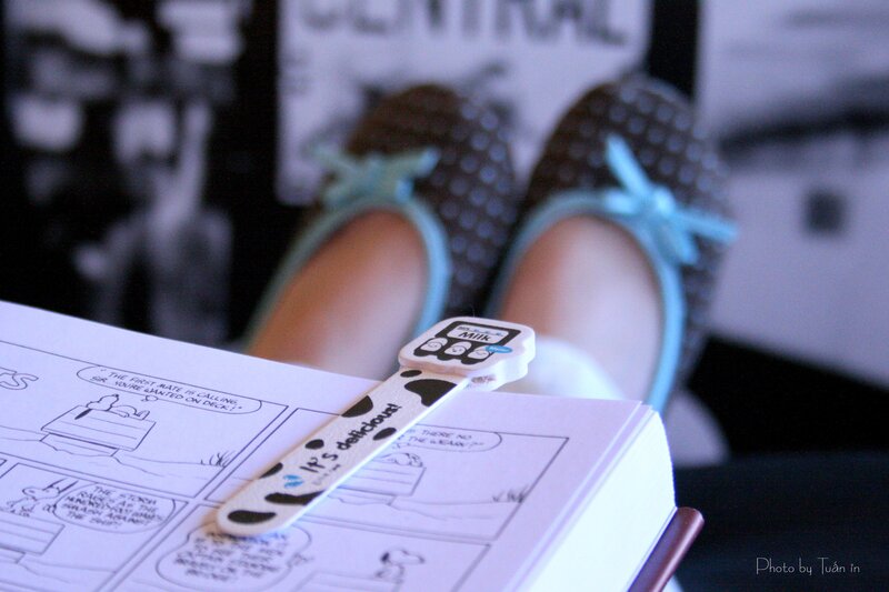 reading comic book with bookmark