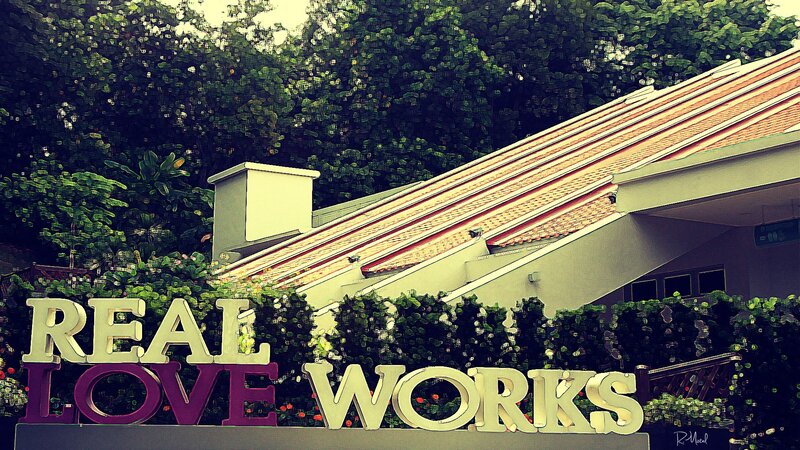 Real Love Works sign at a building