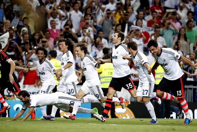 Real Madrid players celebrate a goal
