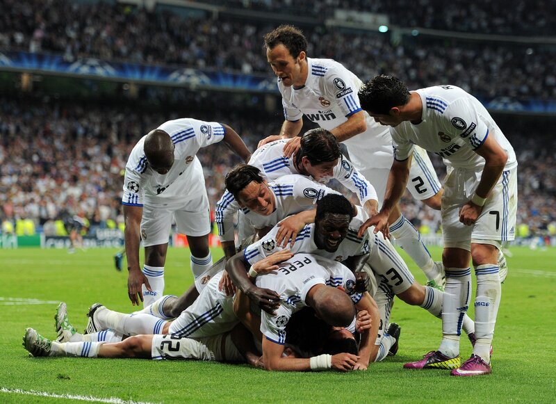 Real Madrid players celebrate on field