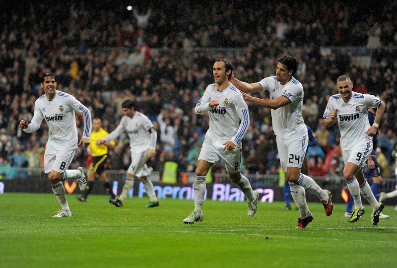 Real Madrid players celebrate on field