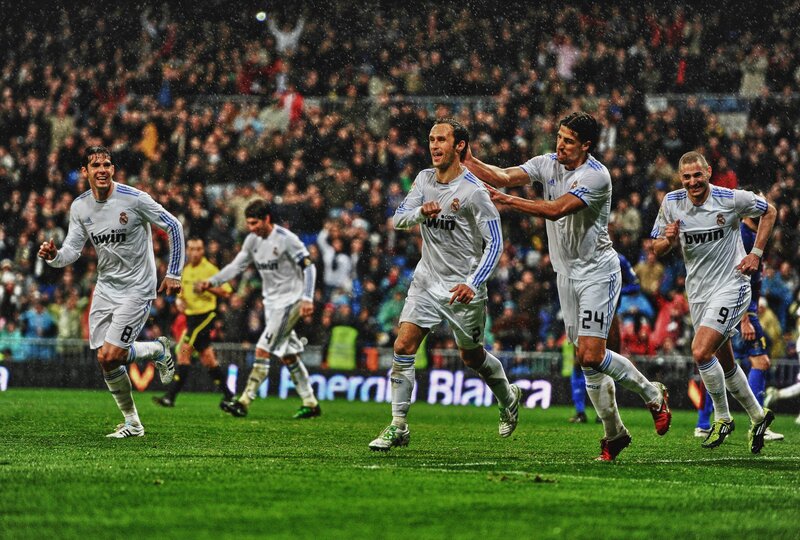 Real Madrid players celebrate on field