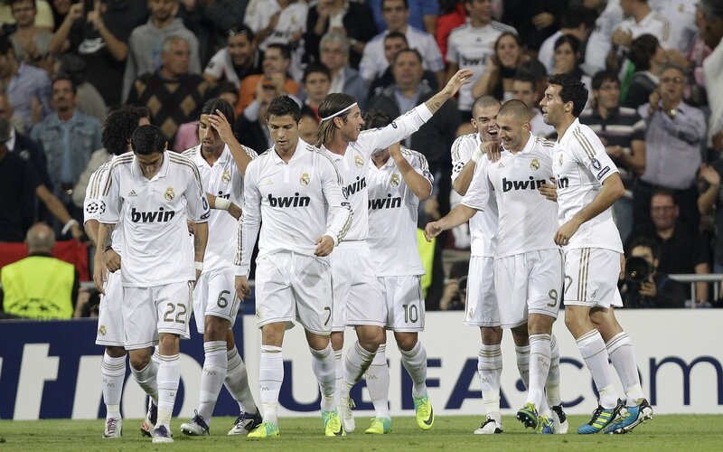 Real Madrid players celebrate on field