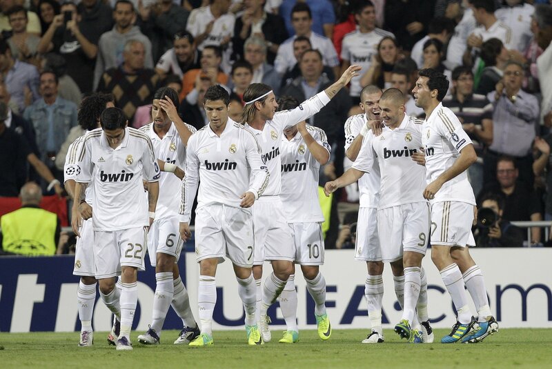 Real Madrid players celebrate on field