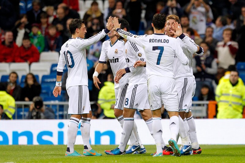 Real Madrid players celebrate on field