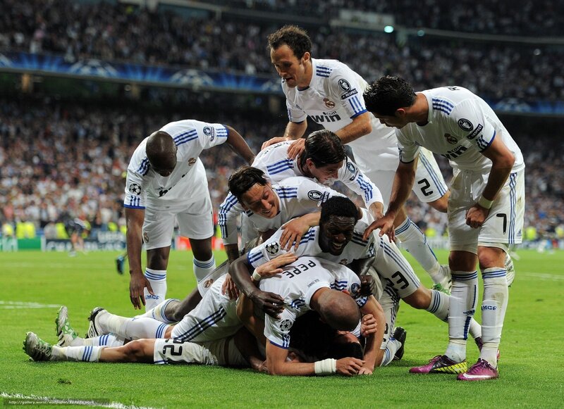 Real Madrid players celebrate on field