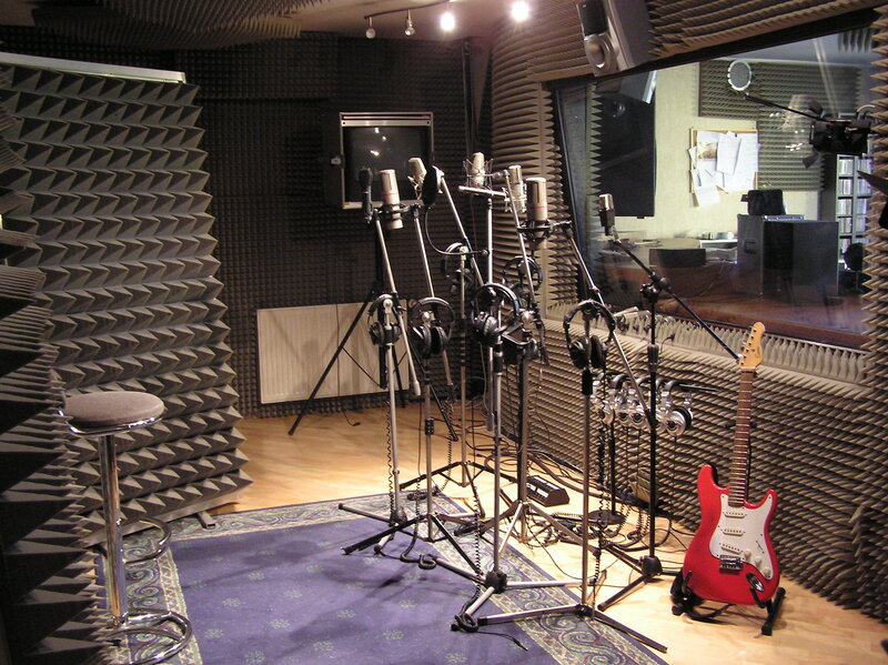 Recording studio with microphones and guitar