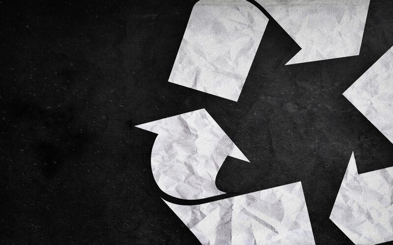 recycling symbol on dark background