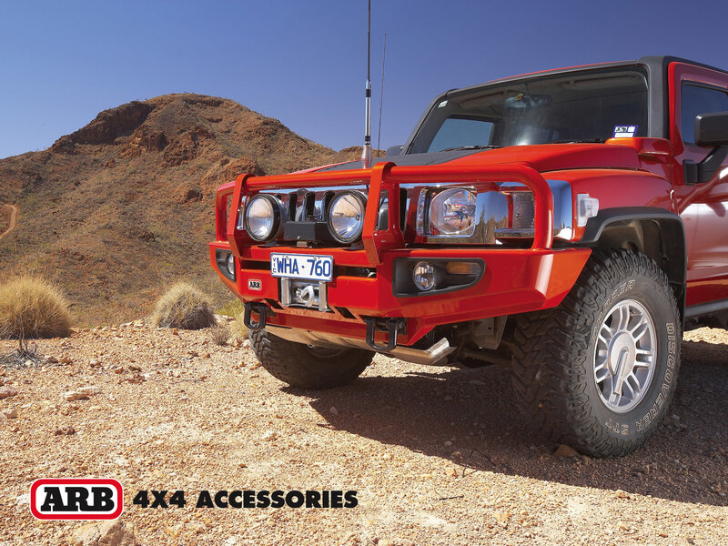 Red 4x4 in desert landscape