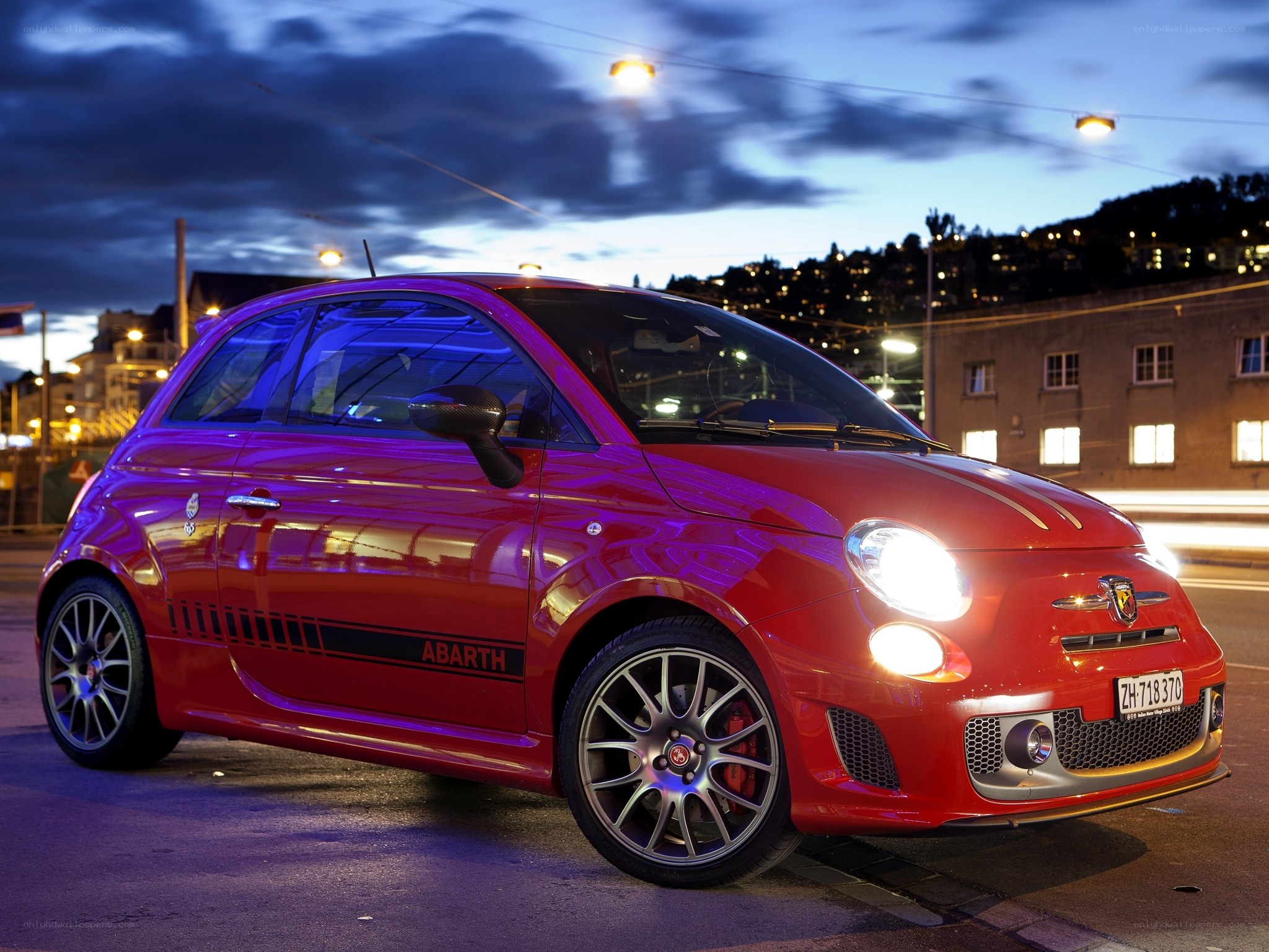 Red Abarth car at dusk
