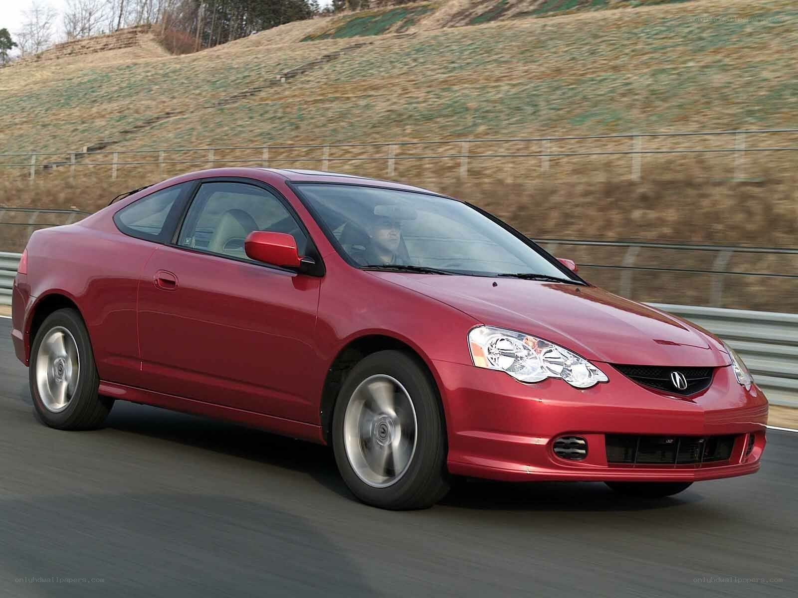 red acura coupe in motion