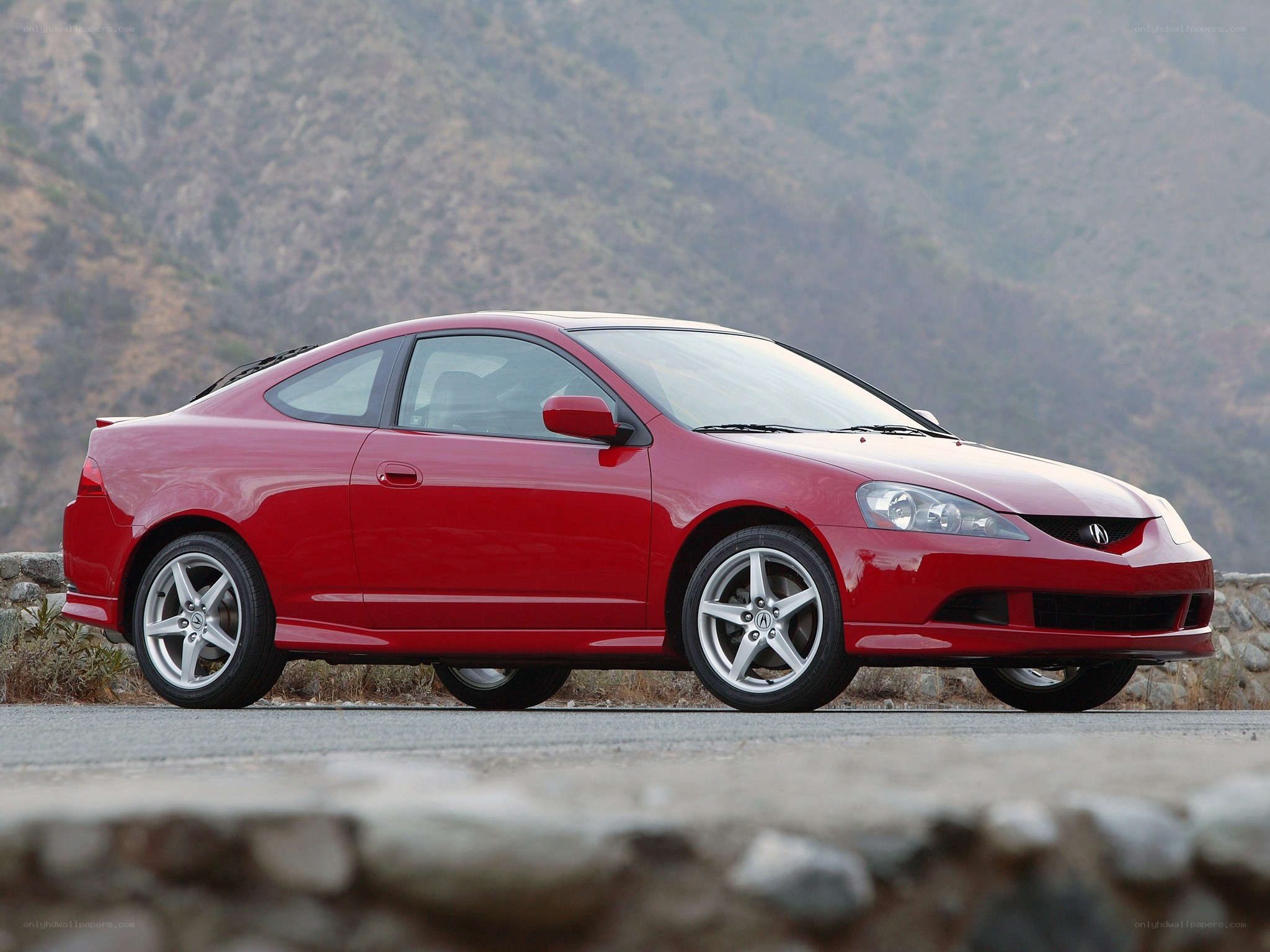red acura coupe on road