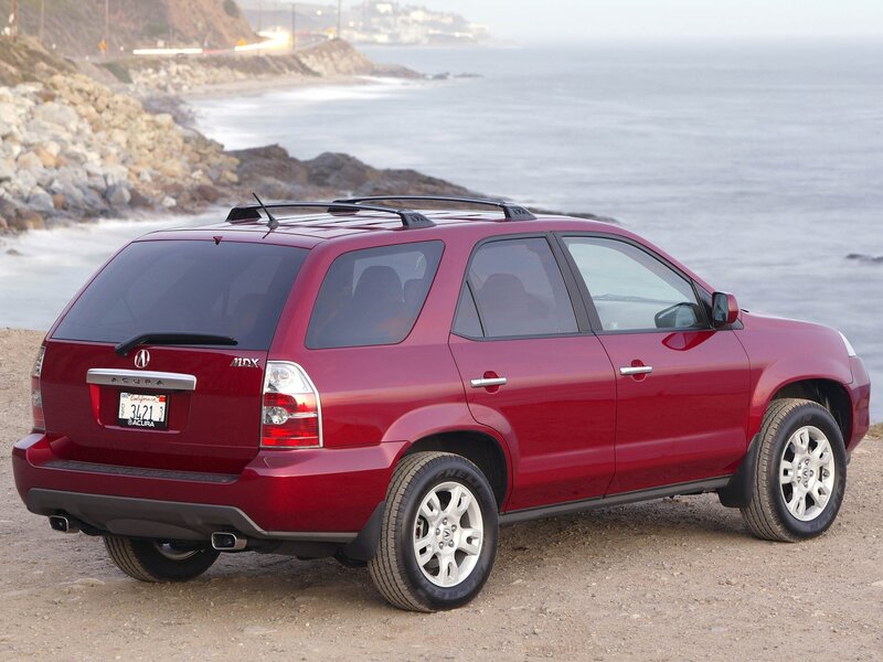 Red Acura MDX by the coast