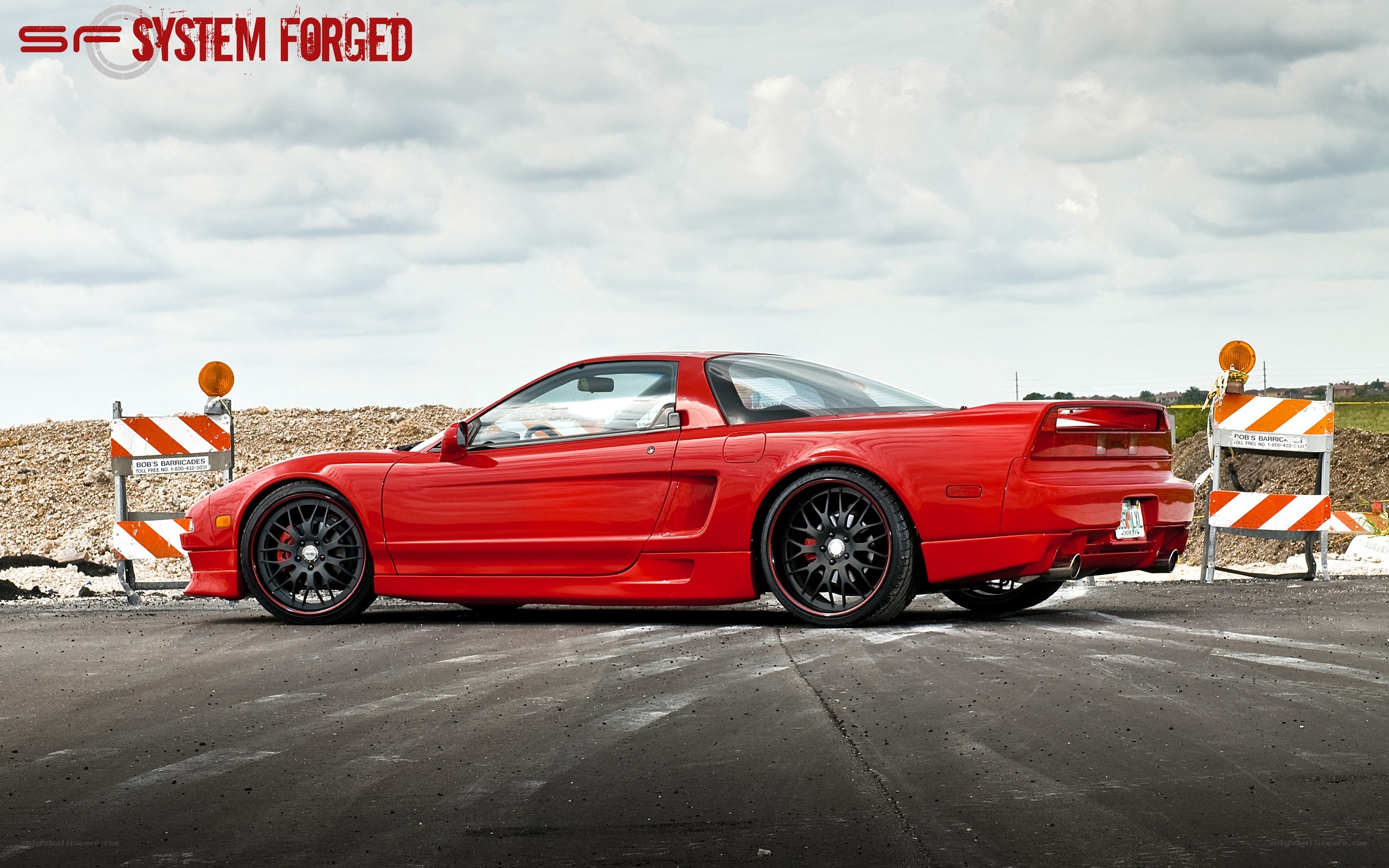 Red Acura NSX with custom wheels