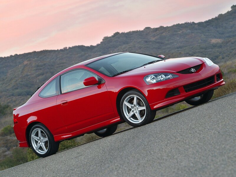 Red Acura RSX on a winding road