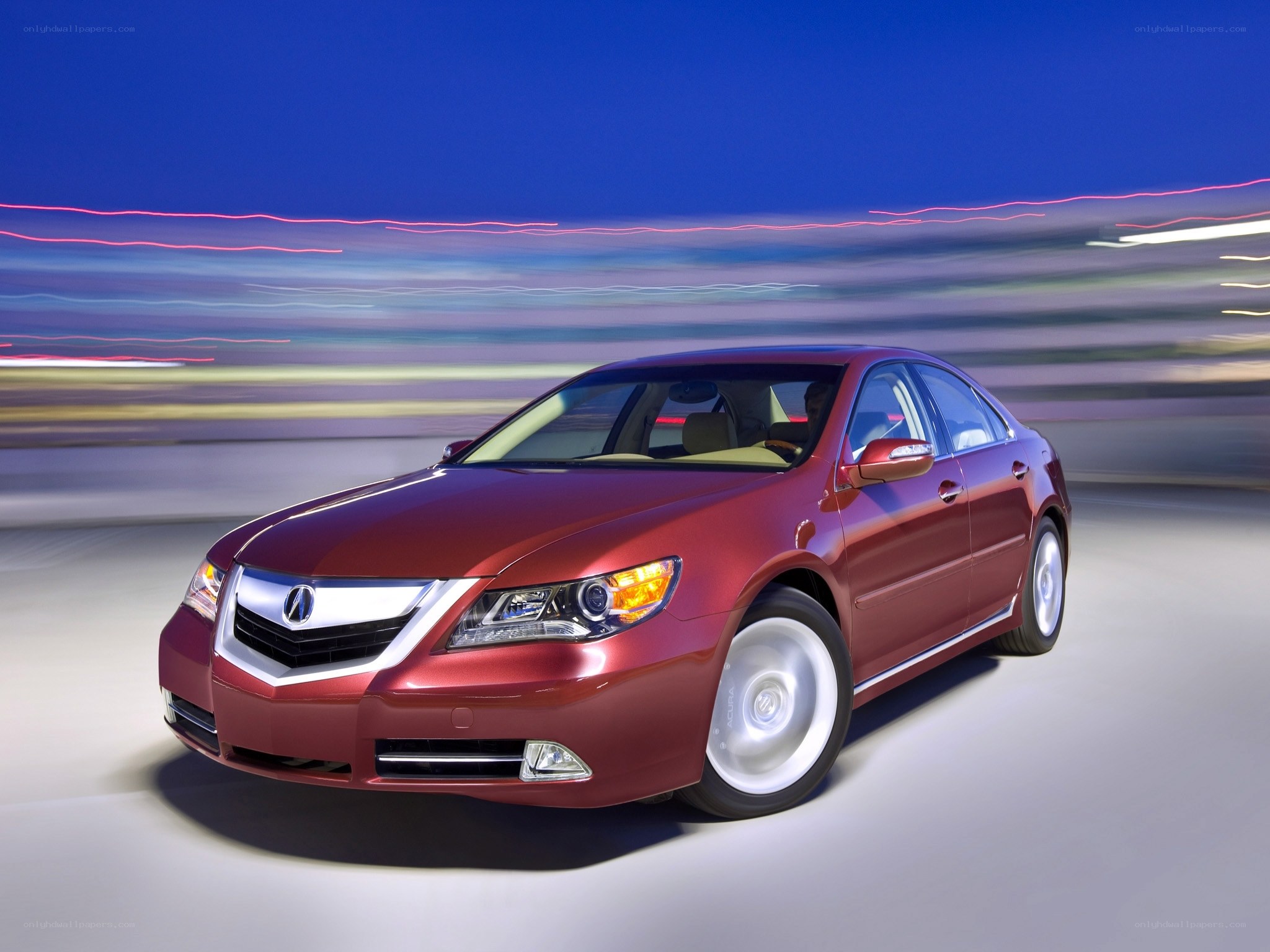 Red Acura TL in motion
