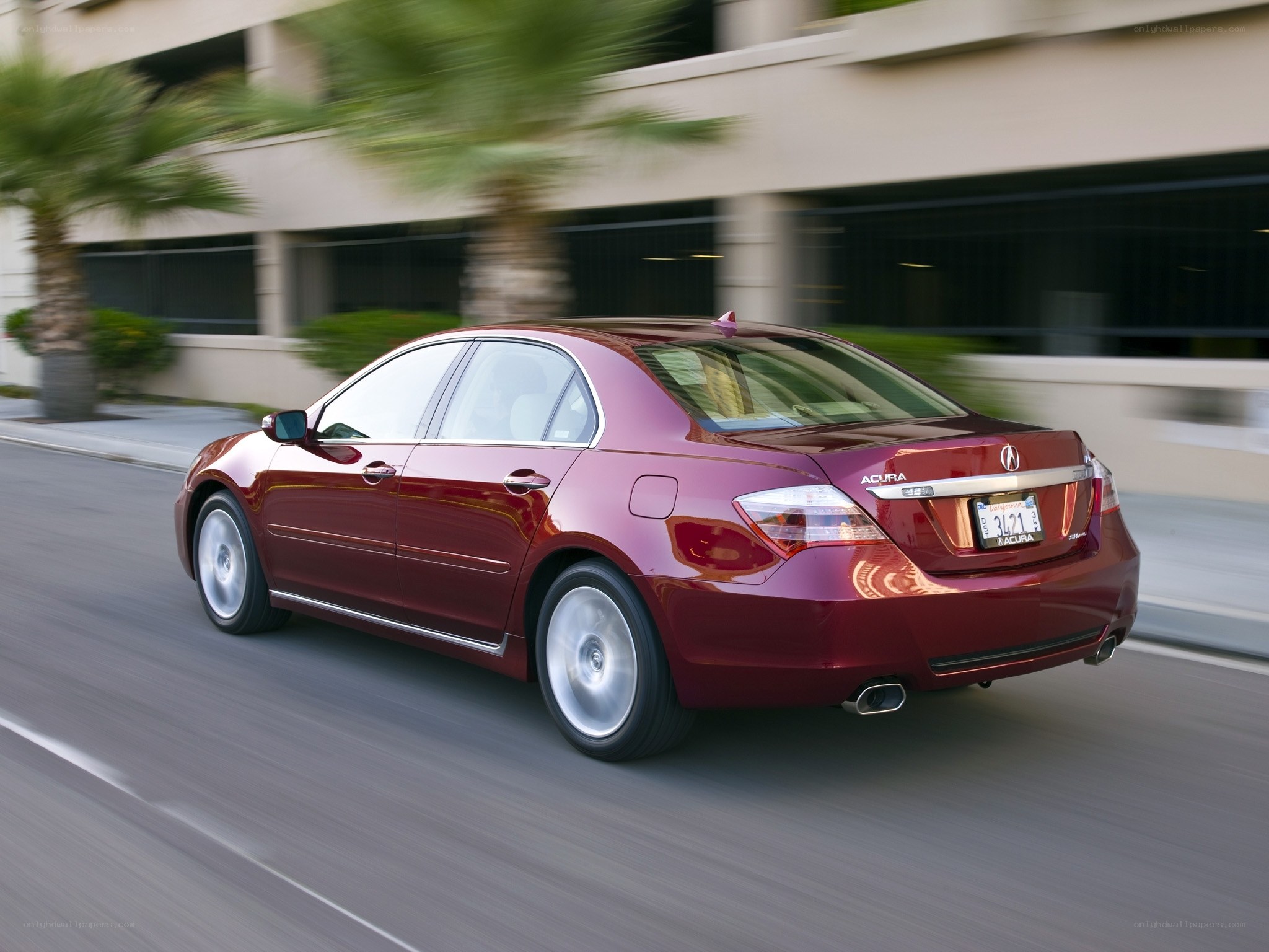 Red Acura TL in motion