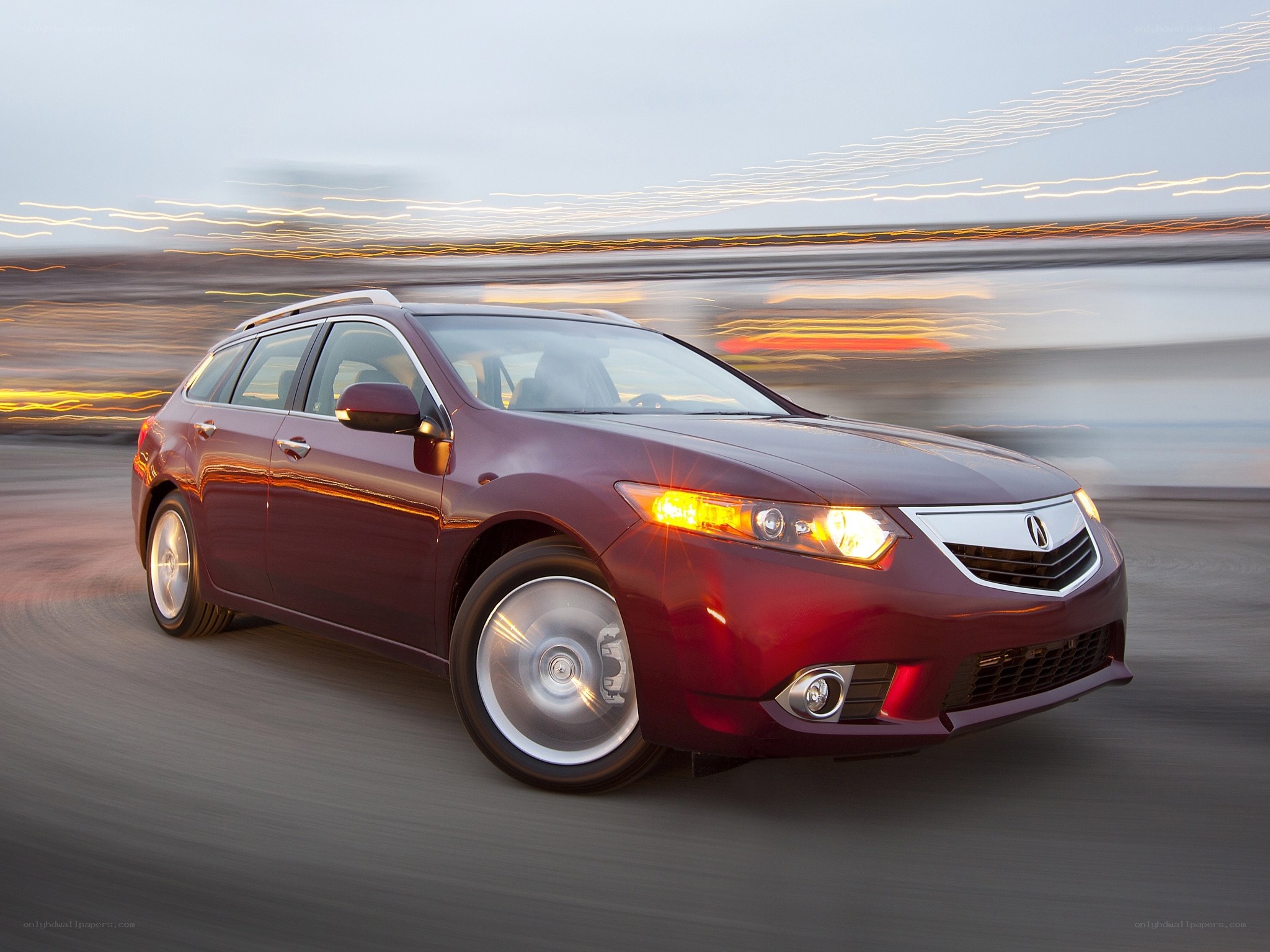 Red Acura TSX Wagon in motion