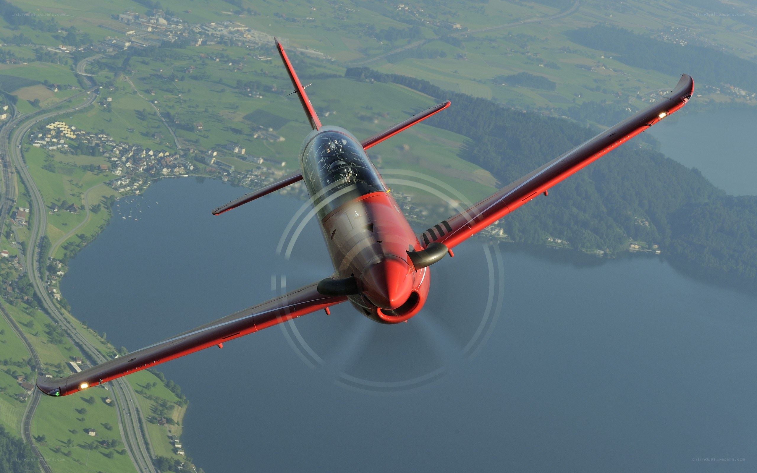 Red aerobatic plane in flight