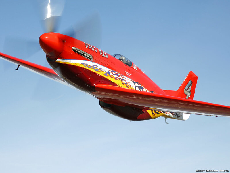 Red aerobatic plane in flight