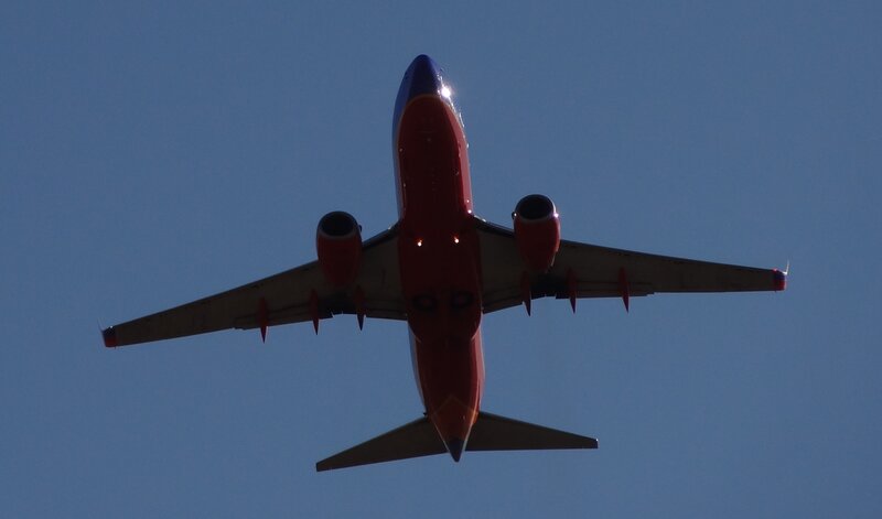 Red Airplane Flying — Dramatic