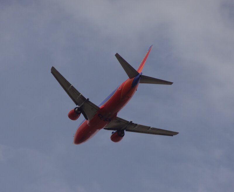 Red Airplane in Flight — Calm, Photograph