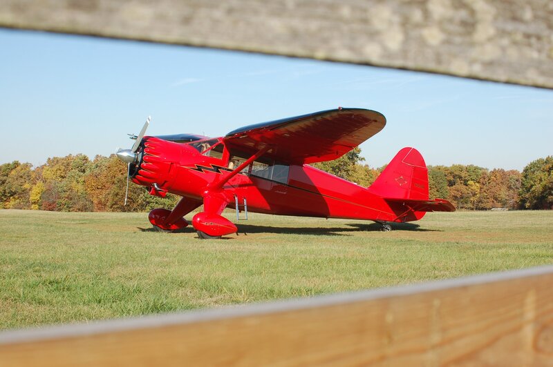 Red Airplane on Grass