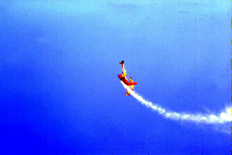 Red Airplane Performing Stunt