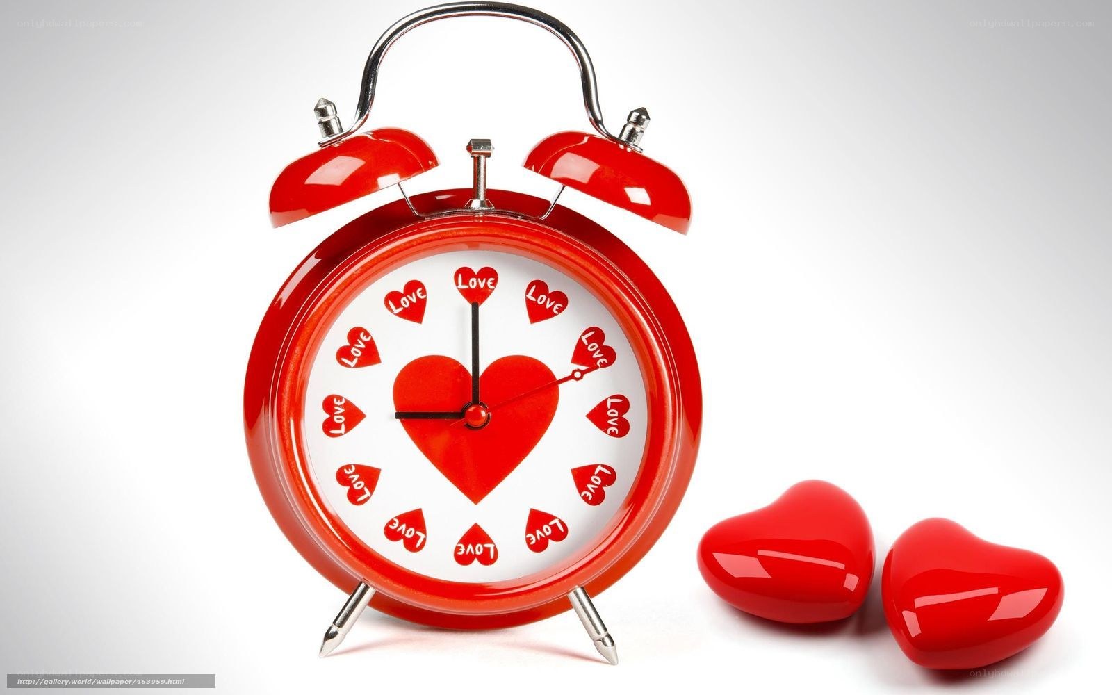 red alarm clock with hearts