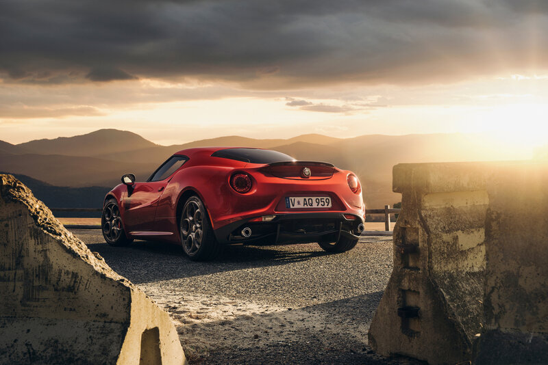 Red Alfa Romeo 4C at sunset