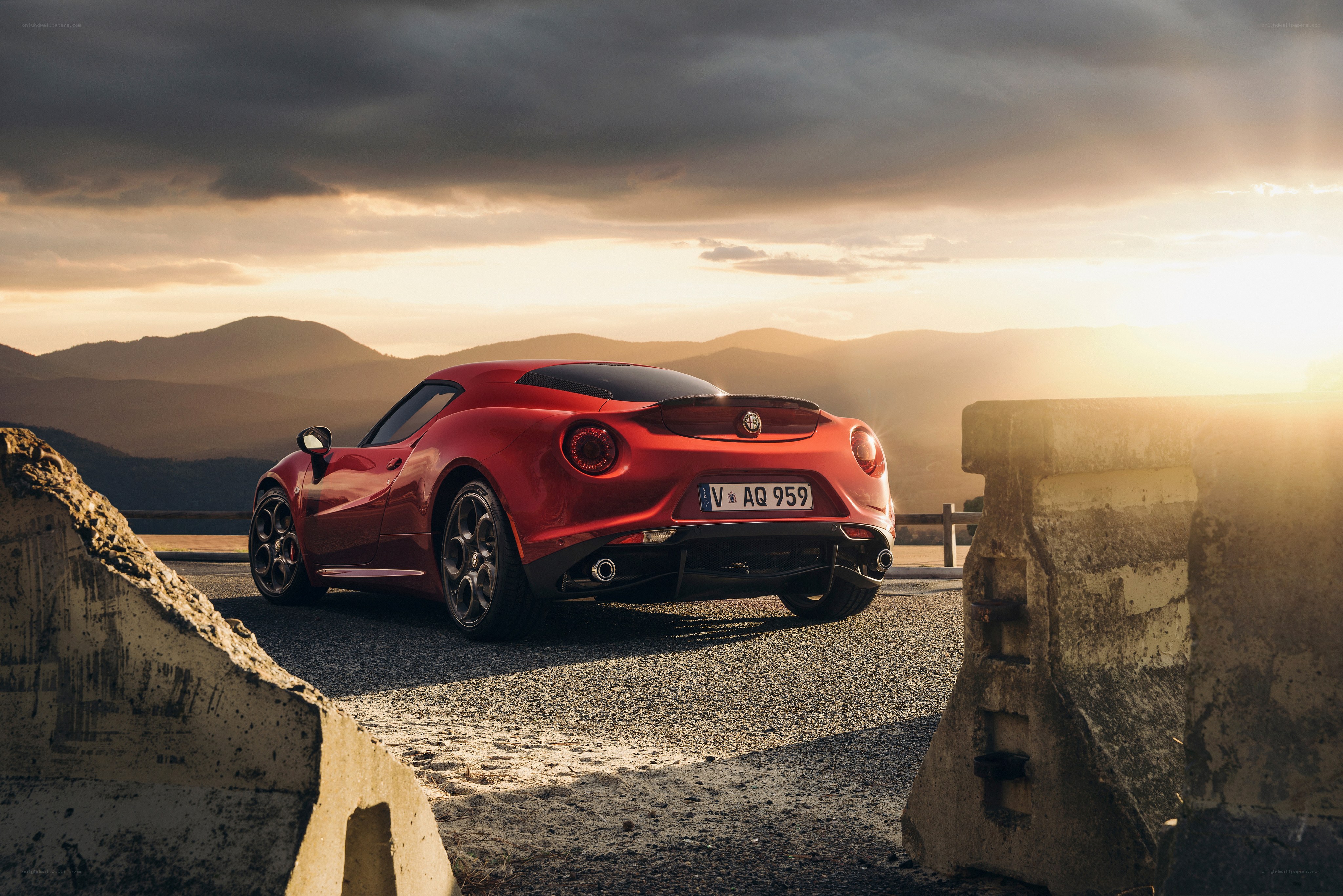 Red Alfa Romeo 4C at sunset