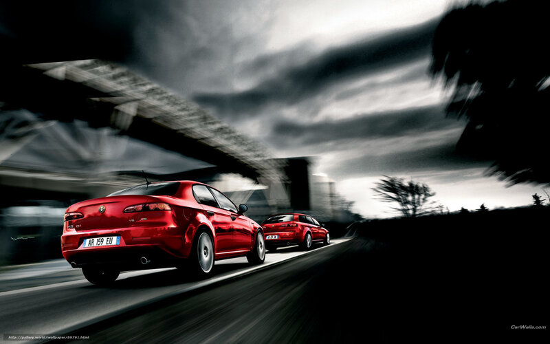 Red Alfa Romeo cars in motion
