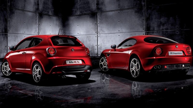 Red Alfa Romeo cars in studio