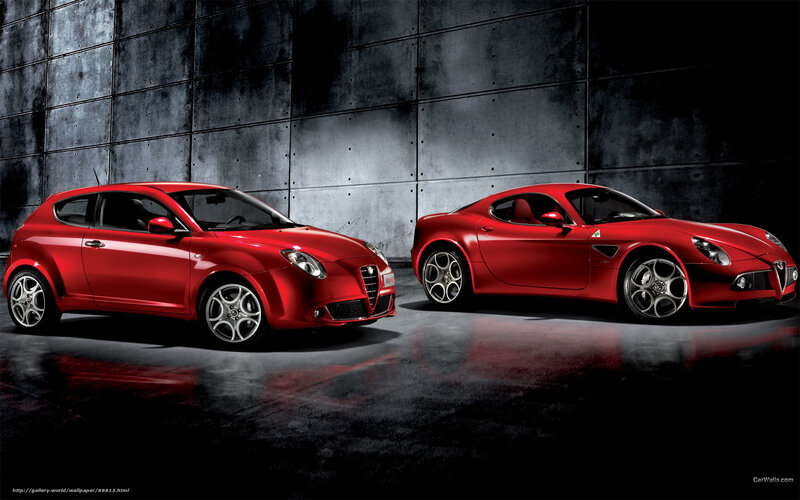 Red Alfa Romeo cars in studio
