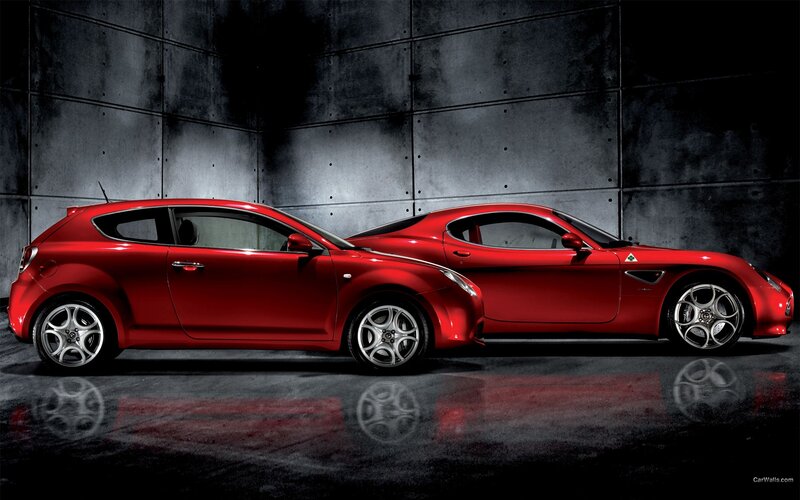 Red Alfa Romeo cars side by side