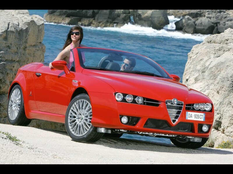 Red Alfa Romeo convertible by the sea