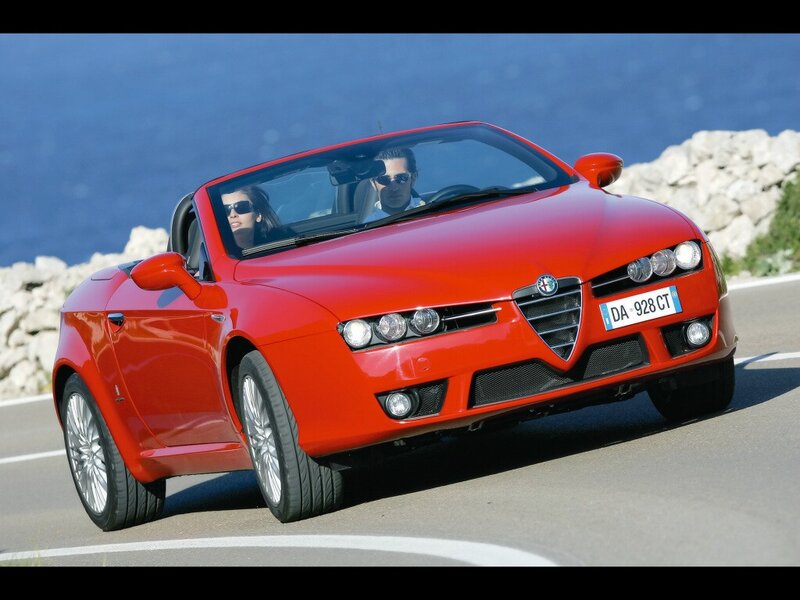 Red Alfa Romeo convertible driving