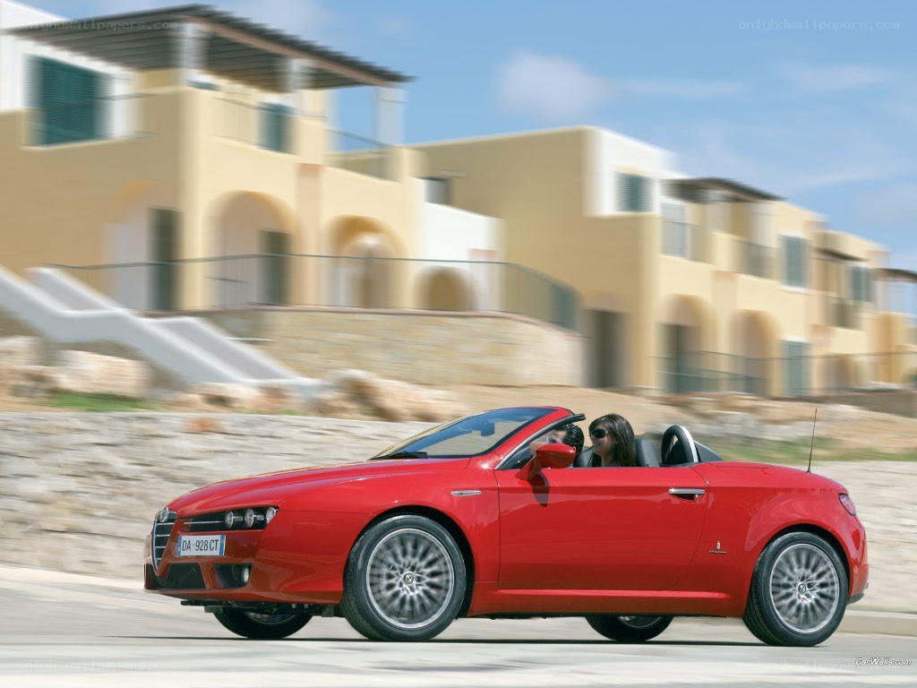 Red Alfa Romeo convertible driving