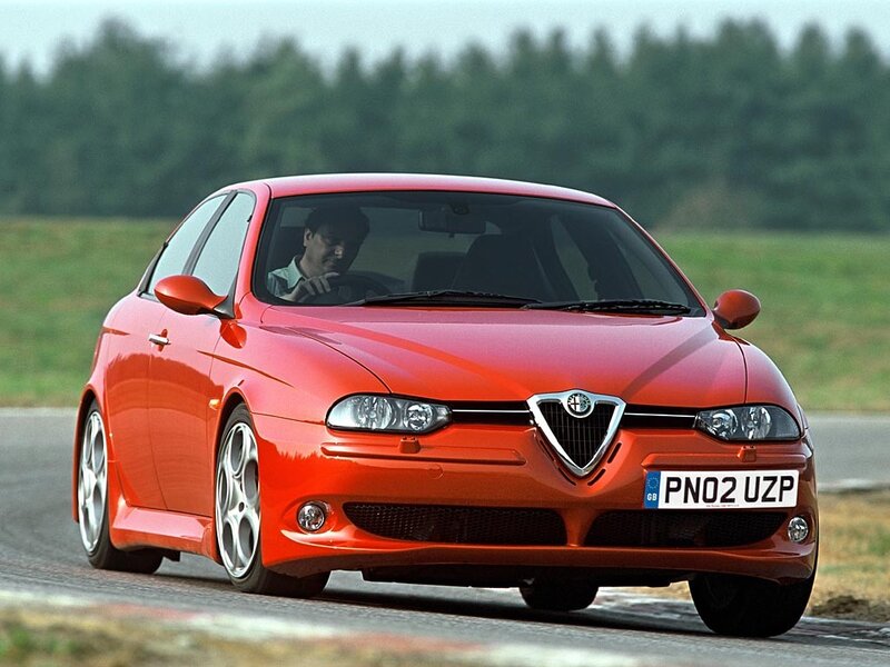 Red Alfa Romeo driving on track