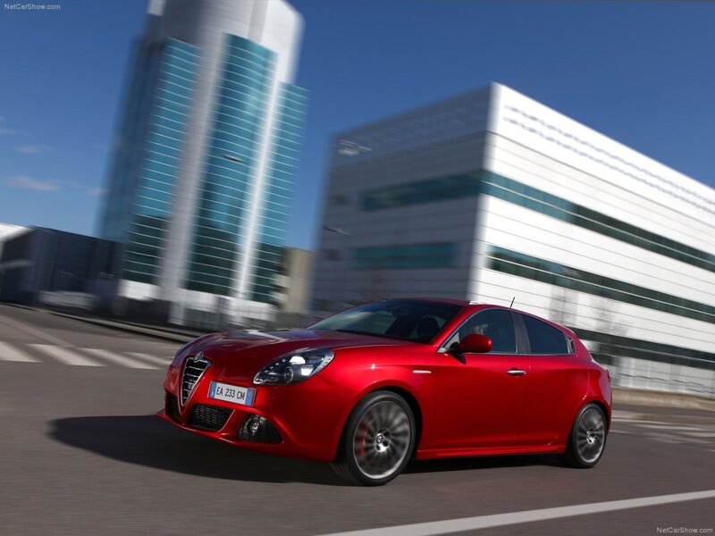 Red Alfa Romeo Giulietta in motion