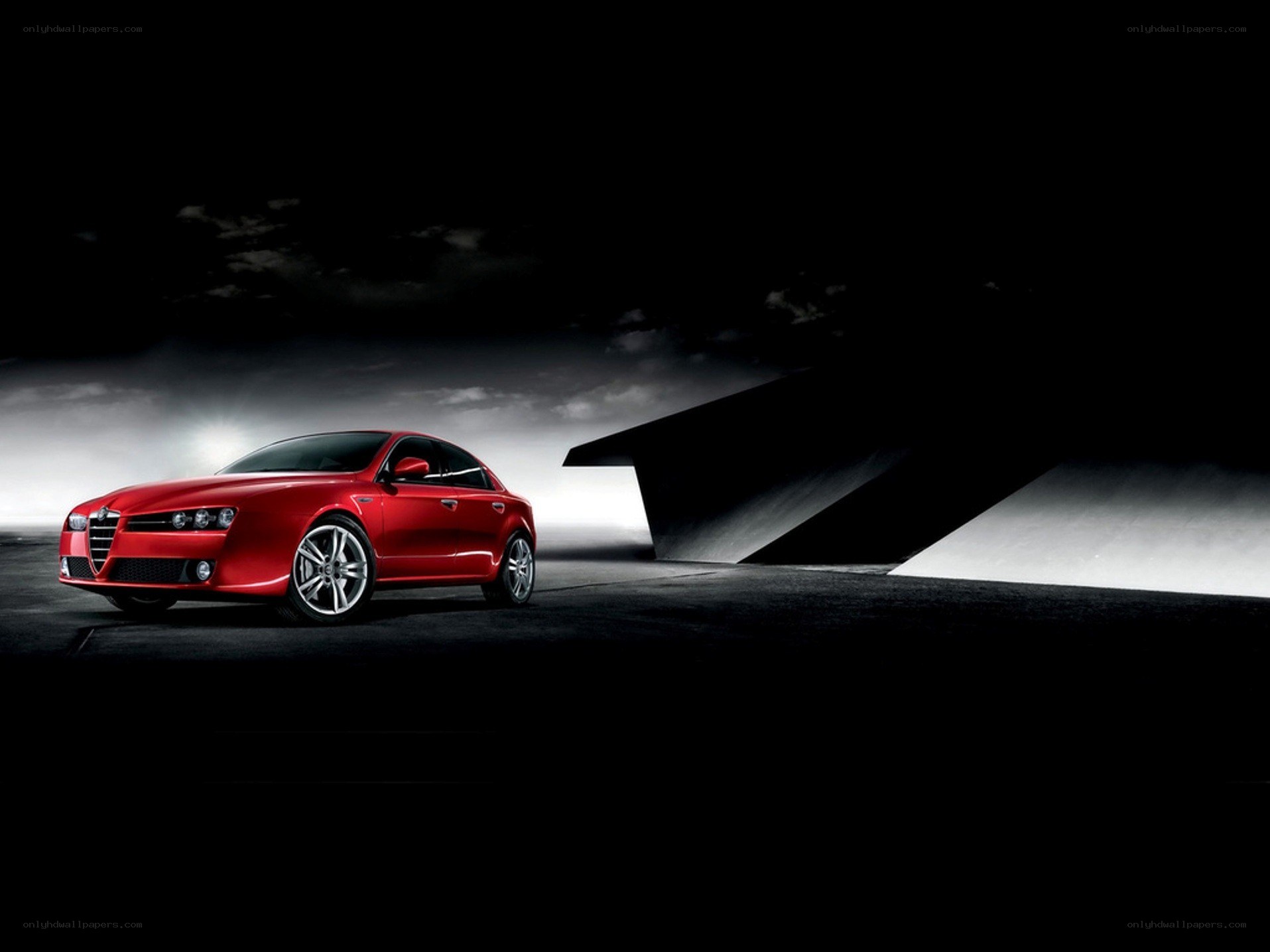 Red Alfa Romeo in dark setting