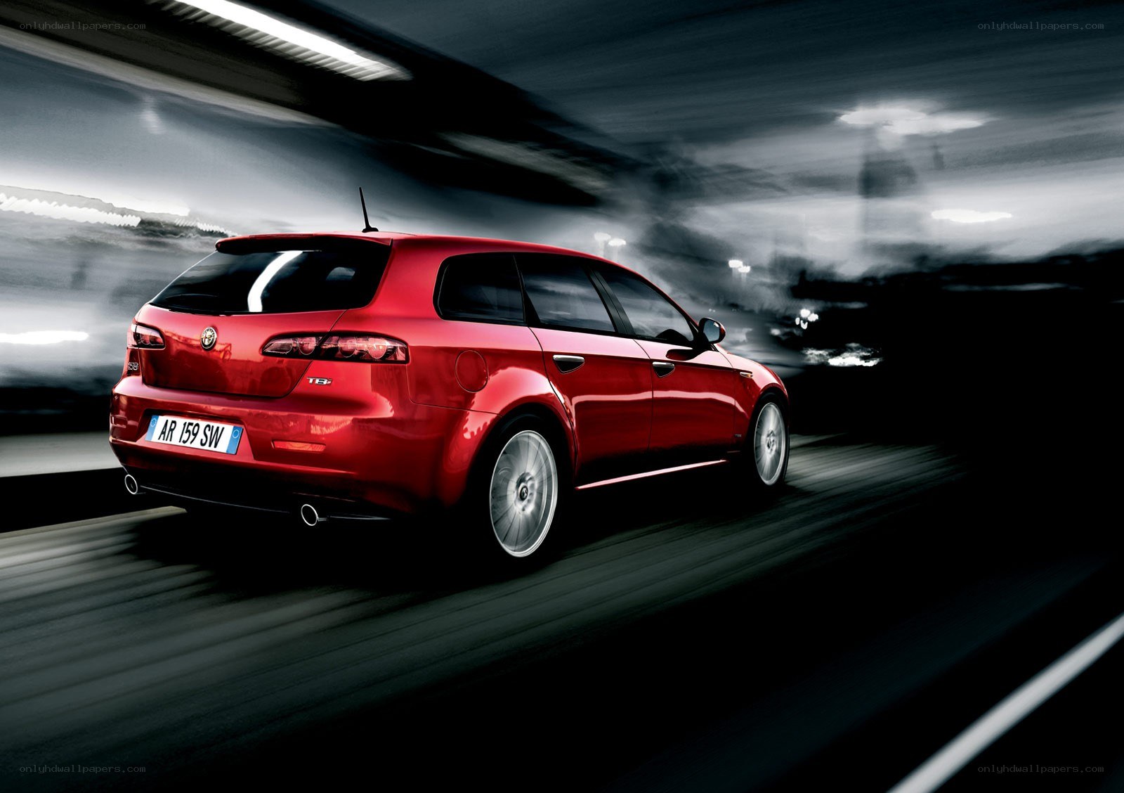 Red Alfa Romeo in motion