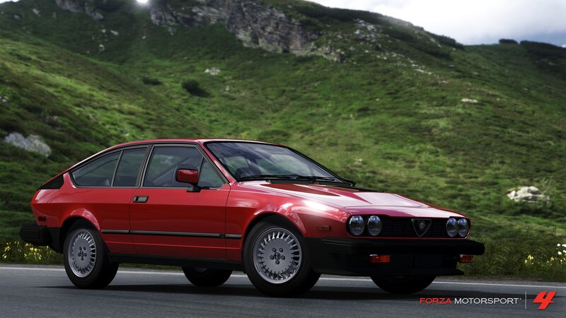 red alfa romeo in mountain pass
