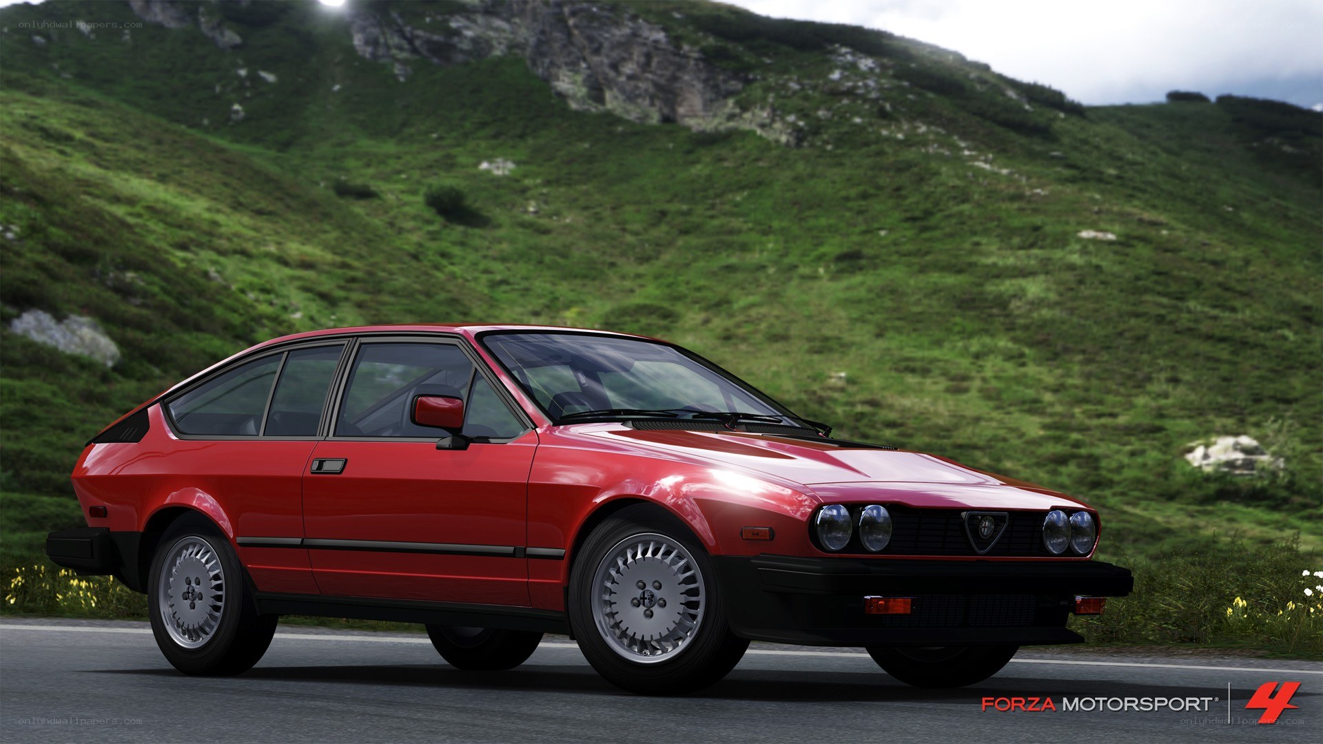red alfa romeo in mountain pass
