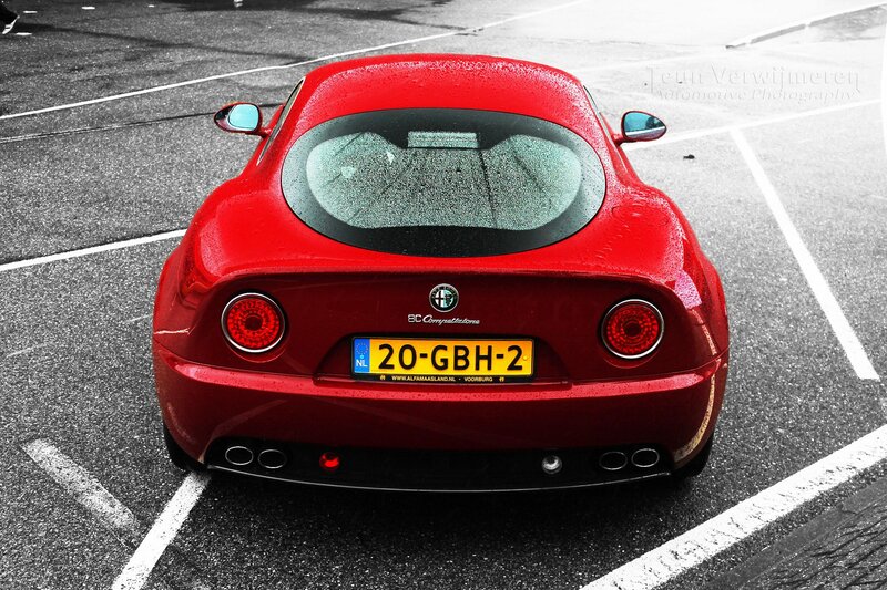 Red Alfa Romeo in parking lot